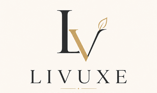 A minimalist logo for LIVUXE on a warm cream background, featuring stylized black and gold letters with a leaf accent and the tagline 'ELEVATING EVERYDAY LIVING'.