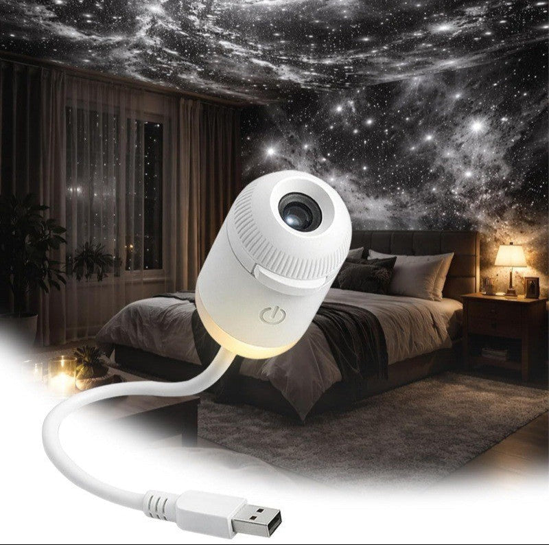 White night light projector on a USB cable in a bedroom setting with starry sky effect.