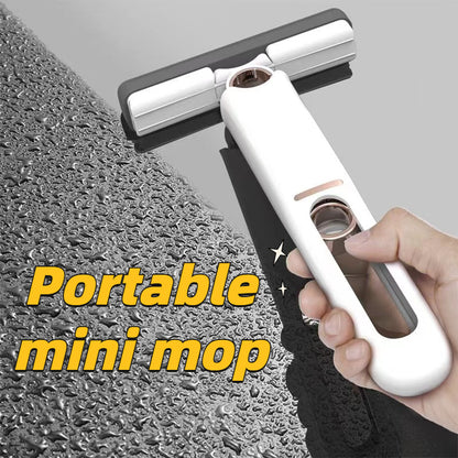 Compact self-wringing mop for bathroom surfaces