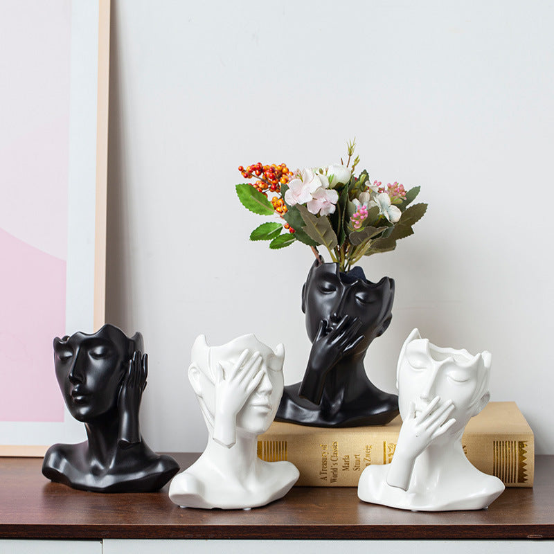 Modern ceramic head vase displayed on a living room shelf