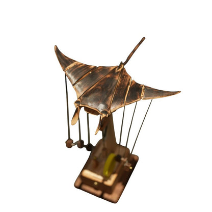Wooden manta ray automaton displayed on an office desk