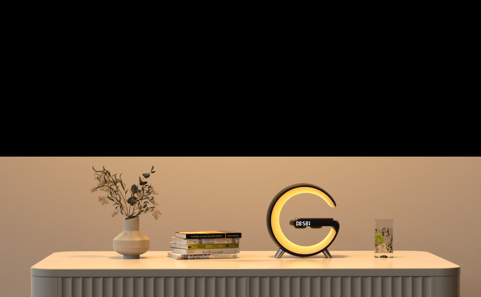 Modern G-shaped LED lamp on a bedroom nightstand